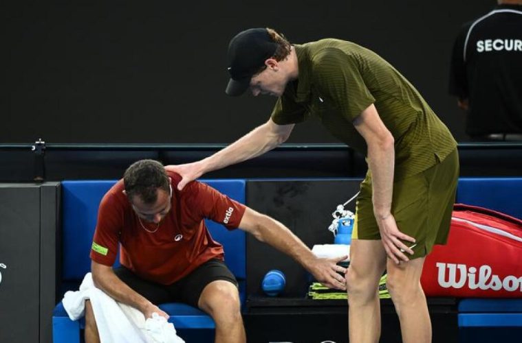 Jannik Sinner comforts rival after shock AO retirement