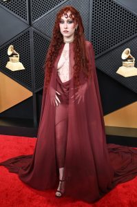 Chappell Roan posing in an avant-garde Mugler ensemble on the Grammys red carpet.