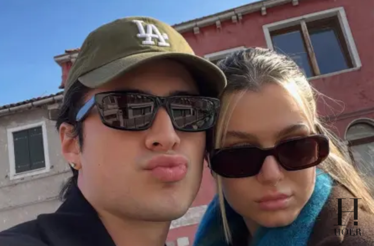 ‘Heated Rivalry’ Star Hudson Williams Hard-Launches His Girlfriend on Valentine’s Day The actor makes it Instagram official A Valentine’s Day reveal 16-Feb-26: Heated Rivalry star Hudson Williams surprised fans on Valentine’s Day by officially introducing his girlfriend on social media — marking a clear “hard launch” of their relationship. The actor shared a cozy, affectionate photo alongside a heartfelt caption, instantly sending fans into celebration mode. Soft launch? Not this time. Making it official Williams, who has largely kept his personal life private, had never publicly confirmed a relationship before. His Valentine’s Day post, however, left no room for speculation. The romantic snapshot featured the couple smiling closely together, with Williams adding a sweet message that hinted at how meaningful the relationship has become. Instagram official. Fans react Within minutes of posting, comments poured in from fans expressing surprise and excitement. Many praised the couple’s chemistry, while others joked that Valentine’s Day was the “perfect PR timing.” The post quickly gained traction, becoming one of his most-engaged uploads to date. Internet approved. Keeping love low-key Prior to the Valentine’s reveal, Williams had rarely spoken publicly about his dating life. The hard launch suggests a new level of comfort and confidence in sharing his relationship with the world. In an era of soft launches and subtle hints, going fully public on the most romantic day of the year made a bold statement. No more guessing. What’s next? While Williams hasn’t shared further details about his girlfriend, the public debut signals a new chapter both personally and professionally. For now, fans are simply enjoying the rare glimpse into the actor’s off-screen romance. Love in the spotlight. FAQs Q1: When did Hudson Williams reveal his girlfriend? He shared the news publicly on Valentine’s Day (16-Feb-26). Q2: What does “hard launch” mean? It refers to officially revealing a relationship publicly, often on social media. Q3: Did he previously confirm the relationship? No, this was his first public confirmation. Q4: How did fans react? Fans responded with excitement and supportive comments. Q5: Has he shared more details? He has not yet revealed additional information about the relationship. ✅ SEO Meta Details Meta Title (Short) Hudson Williams Hard-Launches Girlfriend Meta Description Heated Rivalry star Hudson Williams goes Instagram official with his girlfriend on Valentine’s Day, surprising fans with a romantic hard launch. Keyphrases Hudson Williams girlfriend