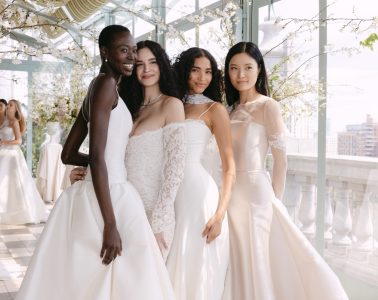 Models at the Sarah Seven Presentation for Bridal Fashion Week. Standing together in a bright terrace in bridal gowns