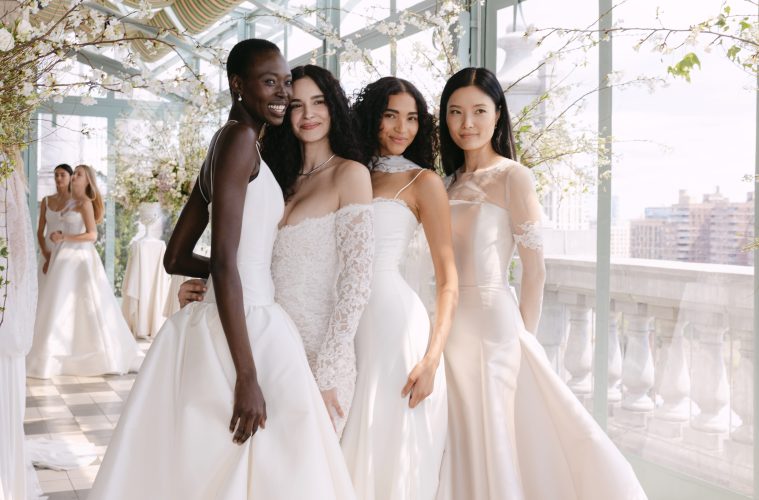 Models at the Sarah Seven Presentation for Bridal Fashion Week. Standing together in a bright terrace in bridal gowns