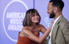 John Legend Saves Chrissy Teigen From AMAs Wardrobe Mishap