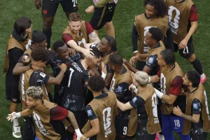 Canada midfielder Stephen Eustáquio (7) celebrates with teammates after scoring in the 92nd minute of a 1-0 win over South Africa in a World Cup round of 32 match at SoFi Stadium on Sunday. (Ronaldo Bolanos / Los Angeles Times)