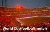 Thousands of football fans in a packed stadium using synchronized smartphone flashlights after scanning a QR code displayed on the stadium screen.