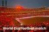 Thousands of football fans in a packed stadium using synchronized smartphone flashlights after scanning a QR code displayed on the stadium screen.