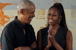 Barack and Michelle Obama smiling together while discussing the perfect date night at the Obama Presidential Center in Chicago.