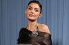 Kylie Jenner poses at a public event wearing a stylish designer outfit, highlighting her signature beauty and fashion aesthetic.