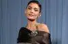 Kylie Jenner poses at a public event wearing a stylish designer outfit, highlighting her signature beauty and fashion aesthetic.