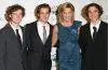 Chris Evert smiles with her three sons, Alex, Nicholas, and Colton, during a family gathering.