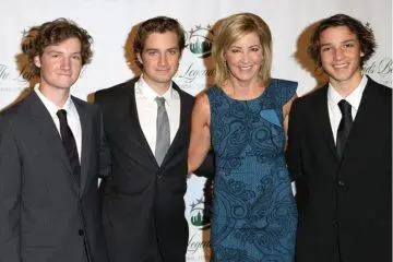 Chris Evert smiles with her three sons, Alex, Nicholas, and Colton, during a family gathering.