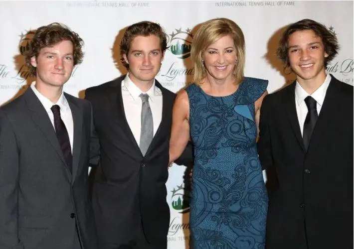 Chris Evert smiles with her three sons, Alex, Nicholas, and Colton, during a family gathering.
