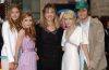 Mary-Kate and Ashley Olsen pose with family members at their brother Trent Olsen's wedding celebration.