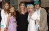 Mary-Kate and Ashley Olsen pose with family members at their brother Trent Olsen's wedding celebration.