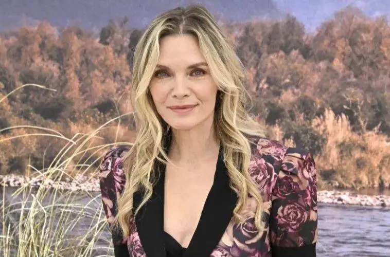 Michelle Pfeiffer smiles during an interview while reflecting on her breakthrough Grease 2 audition experience.