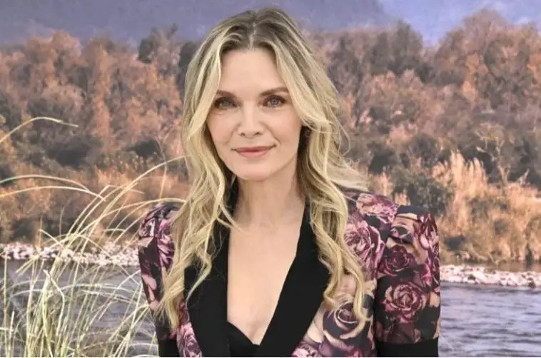 Michelle Pfeiffer smiles during an interview while reflecting on her breakthrough Grease 2 audition experience.