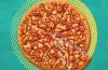 A Little Caesars Webberoni Pizza featuring a Spider-Man-inspired pepperoni web design created for the upcoming Spider-Man movie promotion.