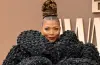 Queen Latifah posing on the red carpet at the 2026 BET Awards in an elegant and stylish outfit.
