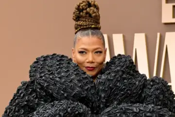 Queen Latifah posing on the red carpet at the 2026 BET Awards in an elegant and stylish outfit.