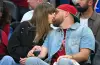 Taylor Swift and Travis Kelce attending a public event as reports about a possible wedding NDA generate widespread discussion.