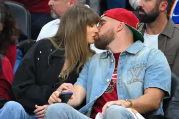 Taylor Swift and Travis Kelce attending a public event as reports about a possible wedding NDA generate widespread discussion.