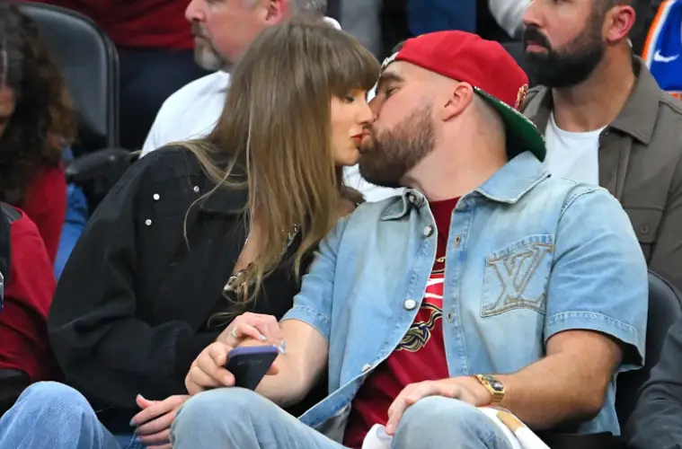 Taylor Swift and Travis Kelce attending a public event as reports about a possible wedding NDA generate widespread discussion.