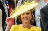 Kate Middleton smiling and interacting with a young fan during her appearance at Royal Ascot, creating a heartwarming royal moment.