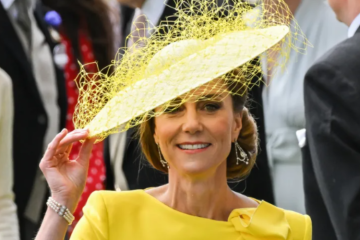 Kate Middleton smiling and interacting with a young fan during her appearance at Royal Ascot, creating a heartwarming royal moment.