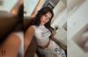 Mikayla Campinos posing for a mirror selfie in a white tank top during her latest Instagram photo carousel that reignited online discussion among fans.
