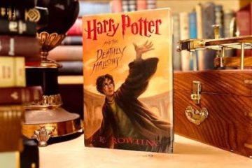 Fans dressed as Hogwarts students gather outside a bookstore during the midnight release of Harry Potter and the Deathly Hallows, celebrating the final book in J.K. Rowling's iconic series.