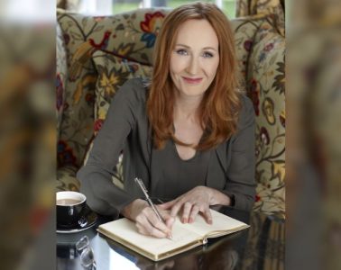 J.K. Rowling at a public event featured in HOLR Magazine's celebrity biography covering her life, Harry Potter journey, books, career, philanthropy, and achievements.