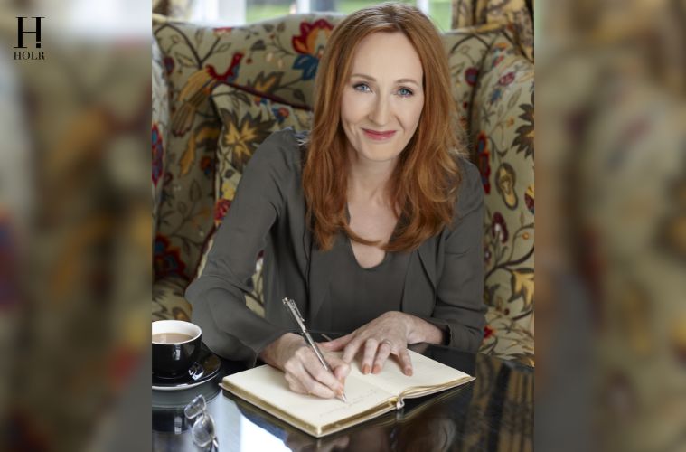 J.K. Rowling at a public event featured in HOLR Magazine's celebrity biography covering her life, Harry Potter journey, books, career, philanthropy, and achievements.