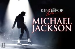 Michael Jackson performing on stage during a live concert, highlighting his legendary music career and status as the King of Pop.