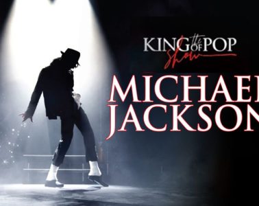 Michael Jackson performing on stage during a live concert, highlighting his legendary music career and status as the King of Pop.