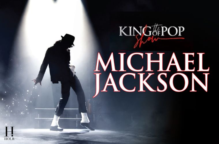Michael Jackson performing on stage during a live concert, highlighting his legendary music career and status as the King of Pop.