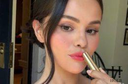 Selena Gomez applying Rare Beauty's new Soft Pinch Lip Oil Stick before its official launch.