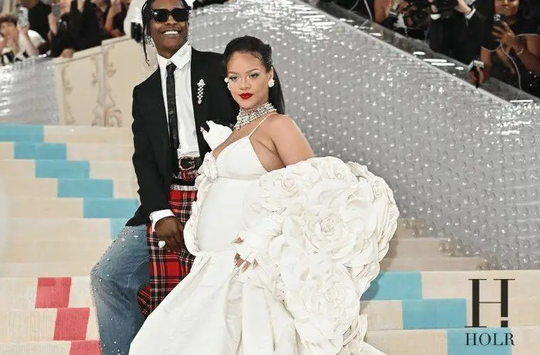 Rihanna and A$AP Rocky attending a red carpet event together.