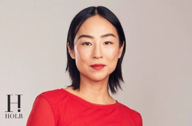 Greta Lee attends a red carpet event while reflecting on her career journey and finding success later in Hollywood.