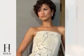 Zendaya wearing an elegant white gown while promoting The Odyssey.