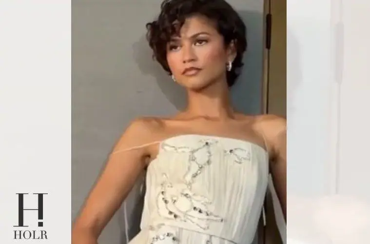 Zendaya wearing an elegant white gown while promoting The Odyssey.