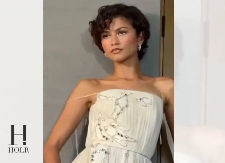 Zendaya wearing an elegant white gown while promoting The Odyssey.