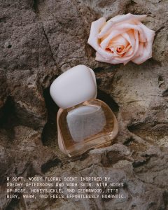 Kylie Jenner poses with the new Mood Stones fragrance trio from Kylie Cosmetics.