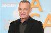 Tom Hanks smiles while attending a Hollywood premiere celebrating his decades-long acting career.