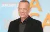 Tom Hanks smiles while attending a Hollywood premiere celebrating his decades-long acting career.