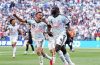 United States and Belgium players compete during their FIFA World Cup Round of 16 match that set a new U.S. television ratings record.