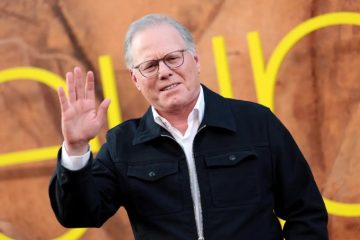 David Zaslav speaking at a corporate event alongside Warner Bros. Discovery branding following his latest scheduled stock sale.