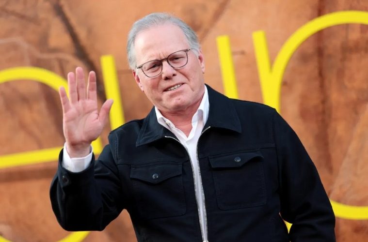 David Zaslav speaking at a corporate event alongside Warner Bros. Discovery branding following his latest scheduled stock sale.