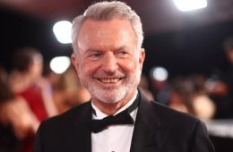 Sam Neill attending a film premiere during his celebrated career in cinema.