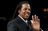 Jay-Z performing at Yankee Stadium after addressing fans about the concert's delayed start.
