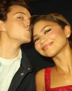 Zendaya and Tom Holland attending a red carpet event while promoting the Spider-Man franchise.