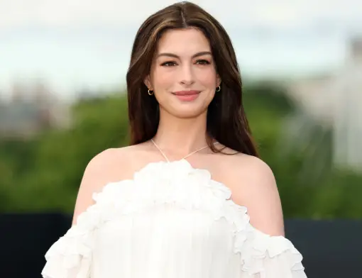 Anne Hathaway poses with her baby bump at The Odyssey London photocall alongside Robert Pattinson and the film's cast.